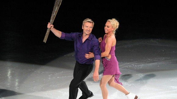 Torvill and Dean skate with Olympic Torch near Walton Sheds 2012 flame near Walton Sheds