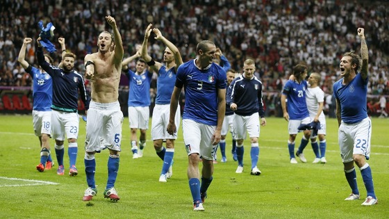 Italian team mates celebrate their shock victory over the German side