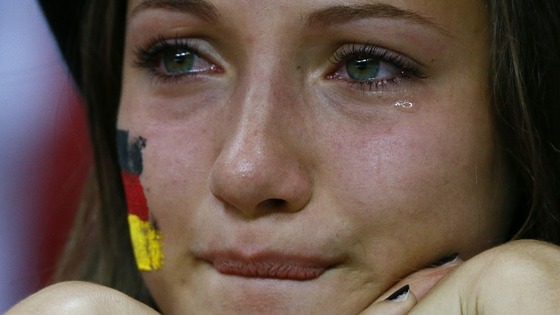 A woman cries as she her German side lose in the Euro 2012 semi-final to Italy 