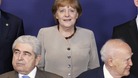 Cyprus' President Demetris Christofias and Greece's President Karolos Papoulias and Angela Merkel