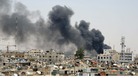 Smokes rises after an explosion was heard near the Palace of Justice in central Damascus