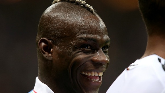 Italian striker Mario Balotelli revels in the spotlight after helping to defeat Germany.