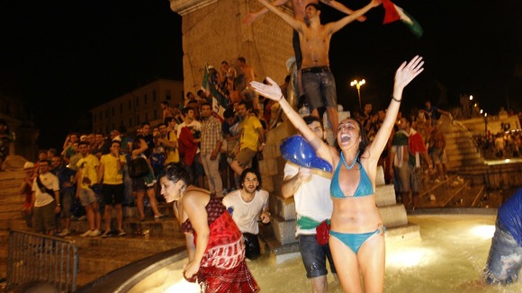 Italian fans celebrate in Piazza del Popolo square in Rome.