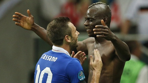 Italy's Mario Balotelli is congratulated by Antonio Cassano after scoring his second.