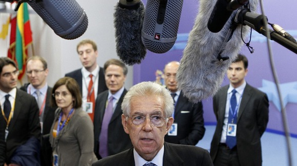 Mario Monti faces the media