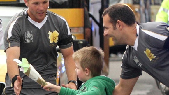 The young 'torchbearer' is stopped before he can complete his relay