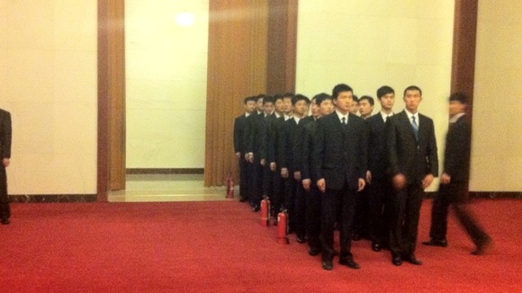 A plain-clothes security team