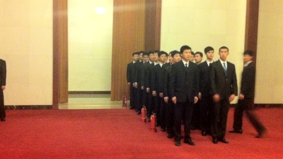 A plain-clothes security team