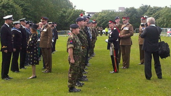 Lord Lieutenant Nigel Sherlock presents medals