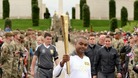 Lance Corporal Johnson Beharry VC carries the torch at the National Memorial Arboretum
