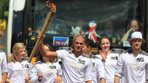 Max George of The Wanted carries the Olympic Flame