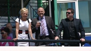 Racegoers enjoy the sunshine in the build up to the race.
