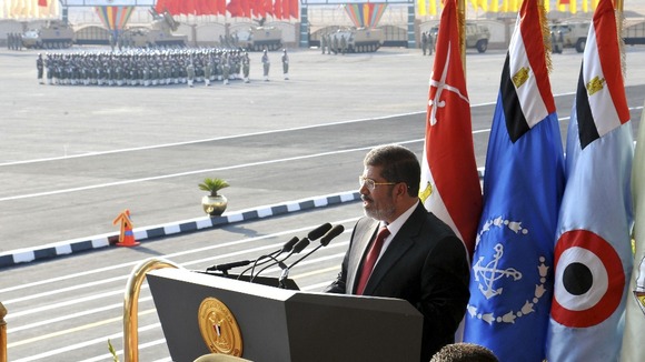 Egypt's new President Mursi delivers a speech during a ceremony