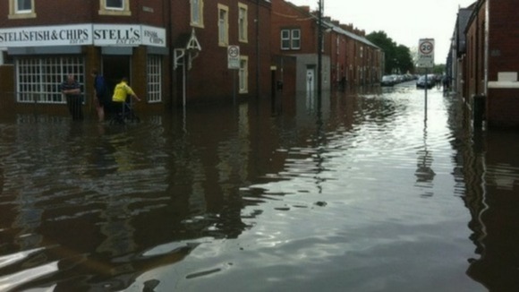 Businesses clean up in Seaton Delaval, Northumberland.