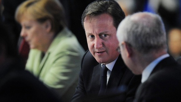Prime Minister David Cameron chats with EU President Herman Van Rumpuy.