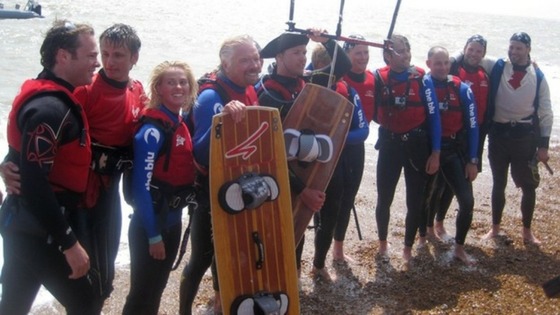 Sir Richard Branson (4th left) on Folkstone Beach after he had to abandon his attempt to kite-surfing across the Channel on Saturday