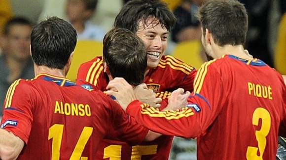 Spain's David Silva (centre) celebrates scoring their first goal of the game with team-mates.