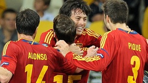 Spain's David Silva (centre) celebrates scoring their first goal of the game with team-mates.