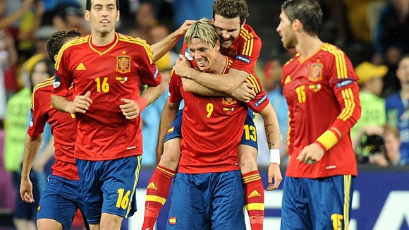 Spain's Juan Mata (centre right) celebrates scoring their fourth goal of the game with team-mate Fernando Torres (centre).
