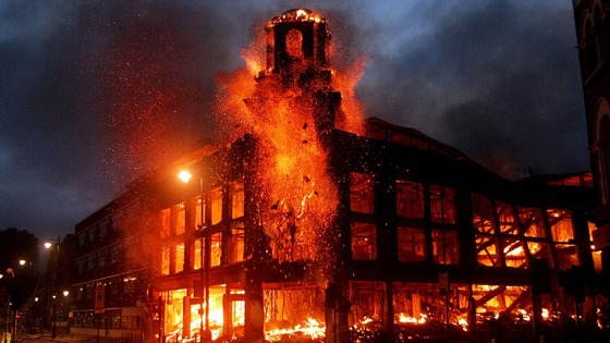 A fire rages through a building in Tottenham, north London, during last summer's riots.