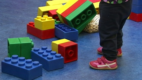 A child plays in a nursery.