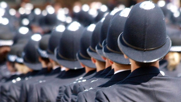 Police graduates at their passing out ceremony at the Hendon police academy, London.