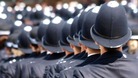 Police graduates at their passing out ceremony at the Hendon police academy, London.