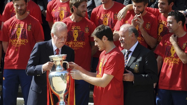 Spain's national soccer team captain Iker Casillas gives the Euro 2012 trophy to Spain's King Juan Carlos