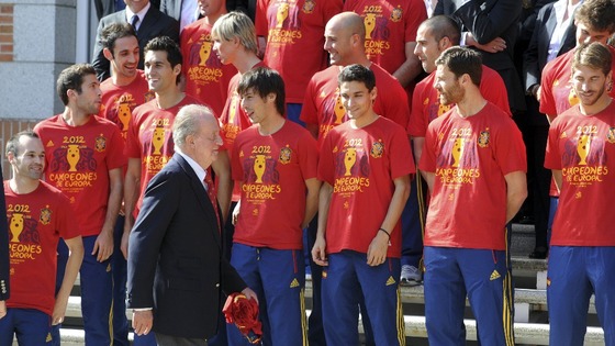 Spain's King Juan Carlos arrives to his place for a family photo with Spain's national football team