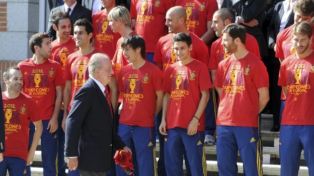 Spain's King Juan Carlos arrives to his place for a family photo with Spain's national football team