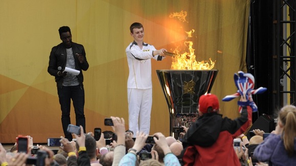 Phil Fuller lights the Cauldron