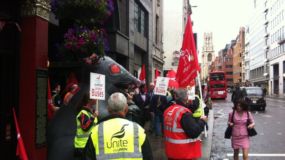 Unite union members crowd the pavement.