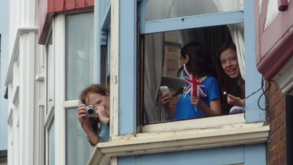 People getting ready to take pictures of the Olympic Torch in Cromer