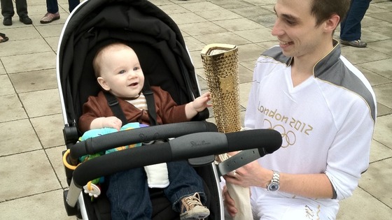7 month old Charlie McLennan and Olympic Torch Runner Nick Haste yesterday in Peterborough.