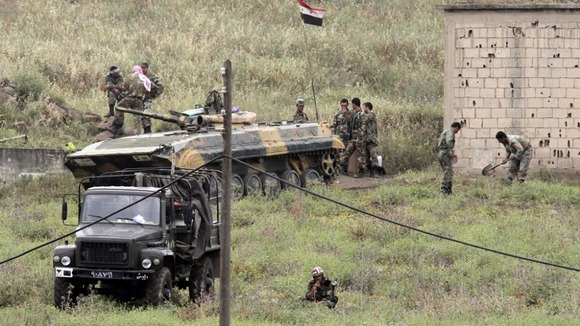 Syrian soldiers and tank