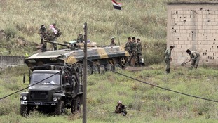 Syrian soldiers and tank