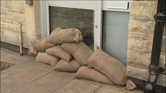 Sandbags block doorways