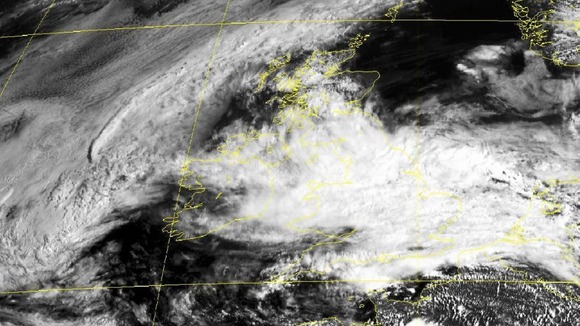 A satellite image showing clouds covering Great Britain as a severe flood warning was issued.