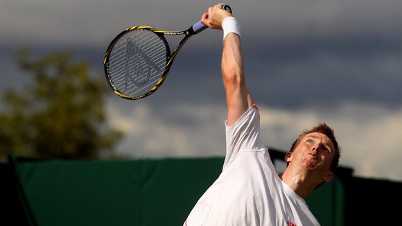 Jonathan Marray serves in his mens doubles semi final match