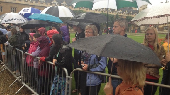 Spectators brave the rain