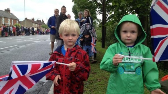 William and Henry wave their flags