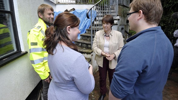 Environment secretary Caroline Spelman (centre) meets Devon residents Philip Nolwenn and Luke Nolwenn