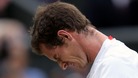 An emotional Andy Murray was beaten by seven-times champion Roger Federer