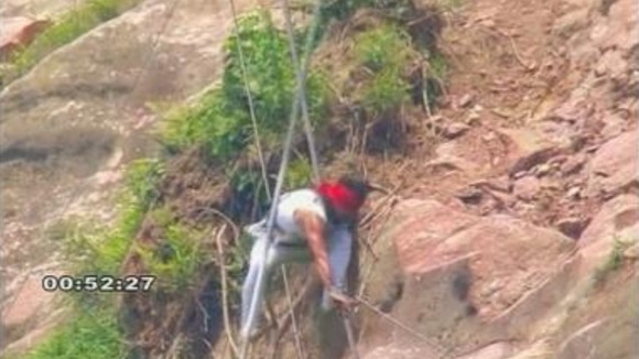 Chinese tightrope walker Aisikaier suffered minor injuries after falling off a high-wire