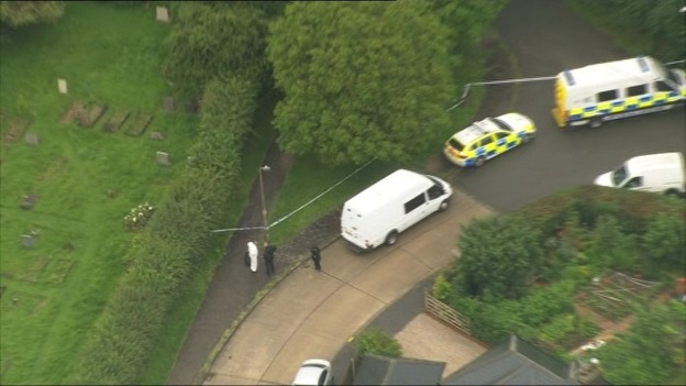 Police officers at the scene in Writtle, Chelmsford.