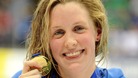 Hannah Miley celebrates with her gold medal after victory in the women's 200m individual medley at the British Gas Swimming Championships.