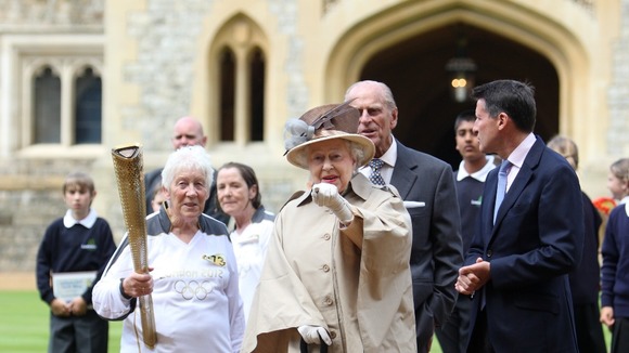 The Queen enjoys the visit of the Olympic Torch.