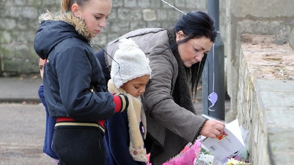 Mourners lay tributes following the death of Casey Kearney.