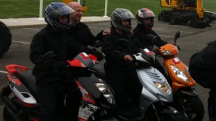 The triplets all arrive to work together on their 50cc scooters
