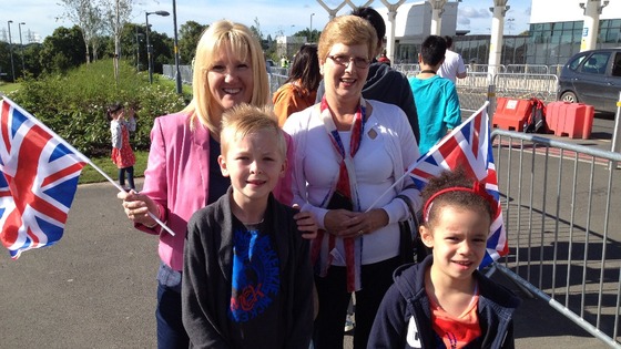 Families take their place to catch sight of the Queen and the Duke of Edinburgh